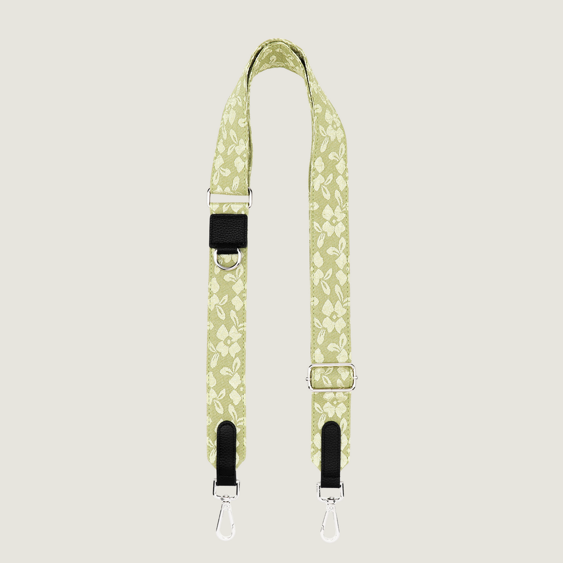 Lichtgroene dogmom strap met gebroduurde bloemenprint zodat je kunt wisselen. De strap heeft zilveren hardware, passend bij onze dogmom bags. Van je de Jaap &amp; Co Botanical Glow collectie. 