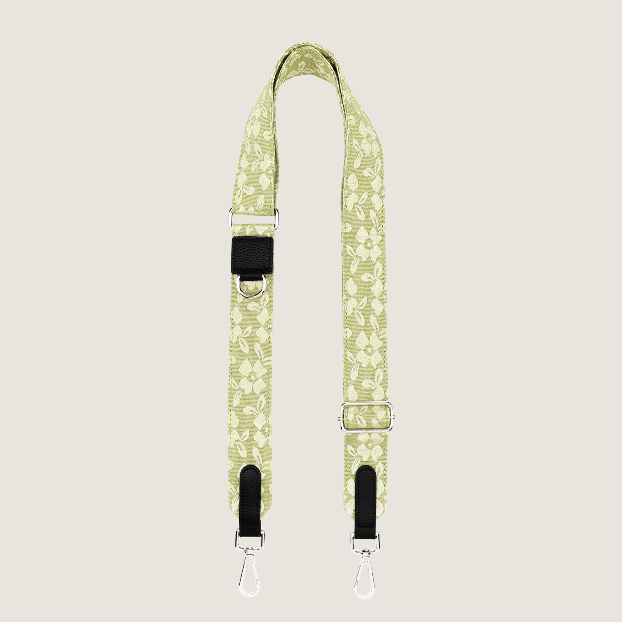Lichtgroene dogmom strap met gebroduurde bloemenprint zodat je kunt wisselen. De strap heeft zilveren hardware, passend bij onze dogmom bags. Van je de Jaap &amp; Co Botanical Glow collectie. 
