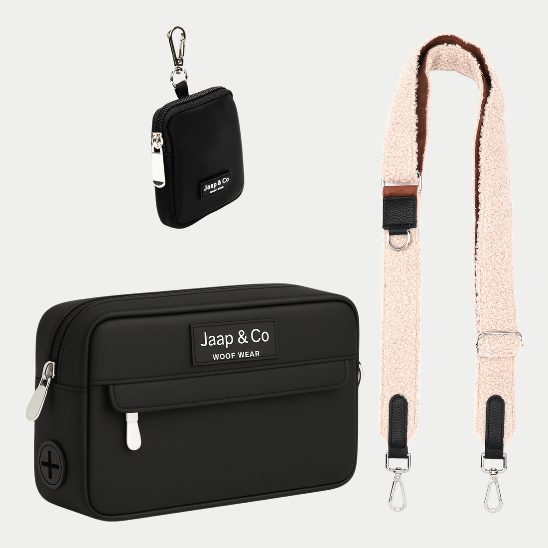 Zwarte dogmom bag met bijpassende treatpouch en verwisselbare strap. Bij deze zet zit de Soft Season strap, een beige teddy stof. 