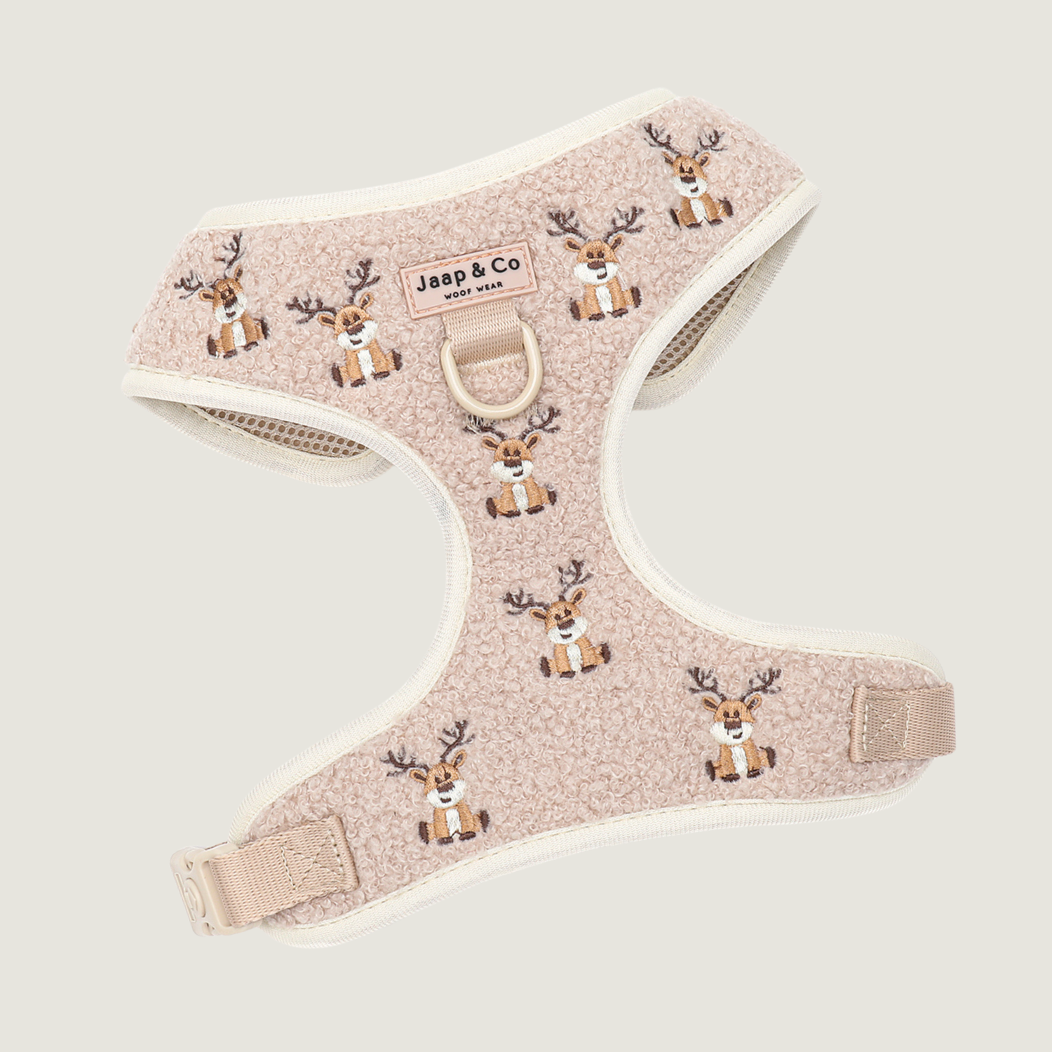 De limited edition hondentuigje voor de kerst. Een prachtige beige teddy stof  met daarop rendieren geborduurd. Aan de binnenkant ademend mesh materiaal.