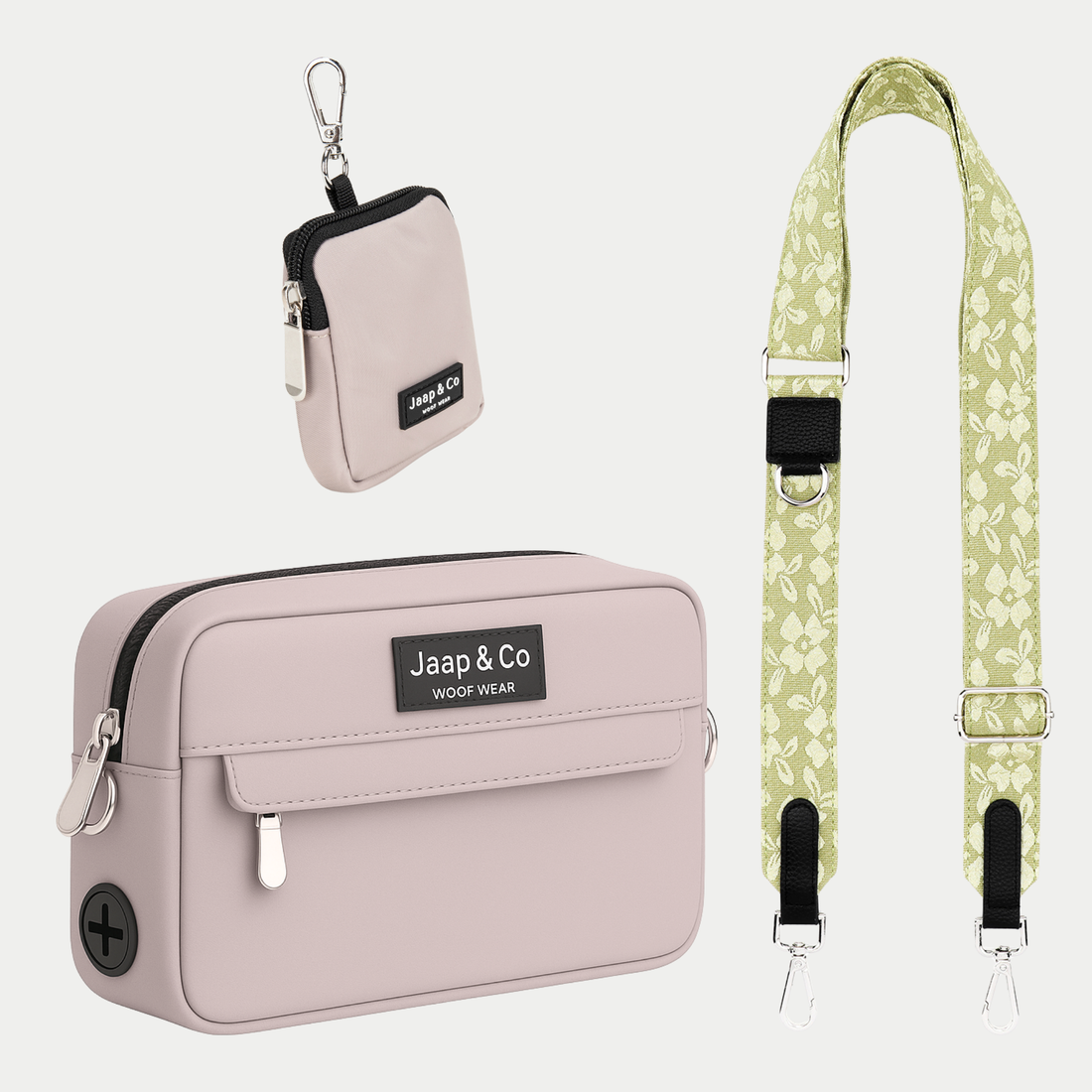 Latte Machiato dogmom bag met treatpouch, een beige/roze achtige kleur gecombineerd met een lichtgroene strap waar een bloemenprint op is geborduurd, deze komt uit de Botanical Glow collectie van Jaap &amp; Co