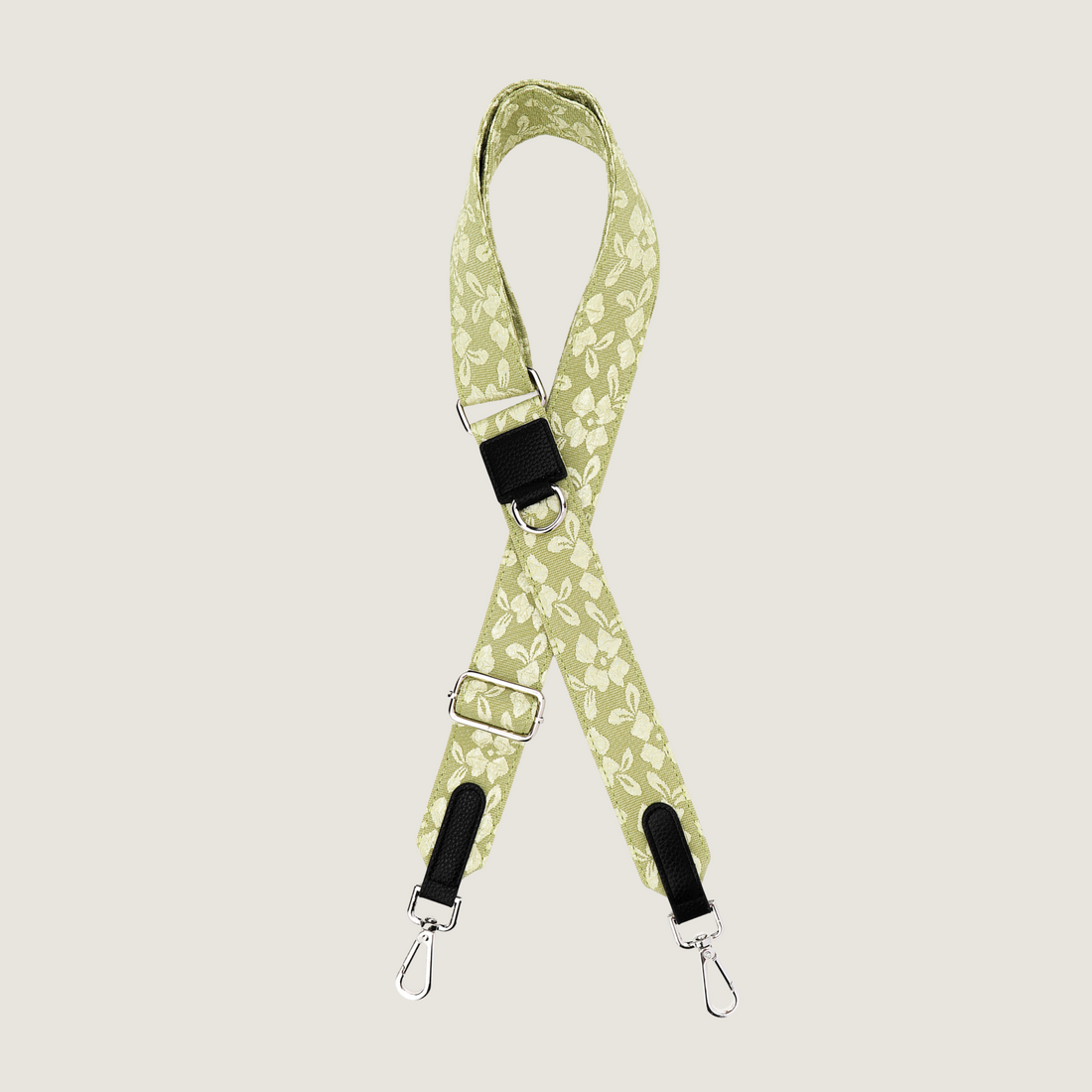 Lichtgroene dogmom strap met gebroduurde bloemenprint zodat je kunt wisselen. De strap heeft zilveren hardware, passend bij onze dogmom bags. Van je de Jaap &amp; Co Botanical Glow collectie. 