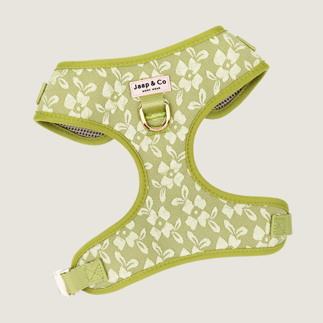 Lichtgroen tuigje met geborduurde bloemenprint met gouden hardware details en een extra D-ring voor anti trek. De Botanical Glow collectie